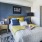 a bedroom with a bed and a fan