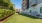 a building with a lawn and a bench
