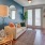 a living room with a couch and a mirror