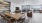 a large living room with a large table and chairs