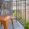 a chair and a plant on a balcony